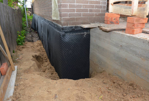 Happy homeowners after waterproofing job in Farmland